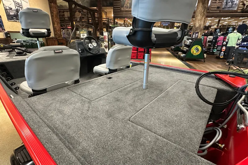 Slide: The Image of 2027 Tracker Bass Tracker Classic XL boat interior with gray seating and carpeted deck. - 15
