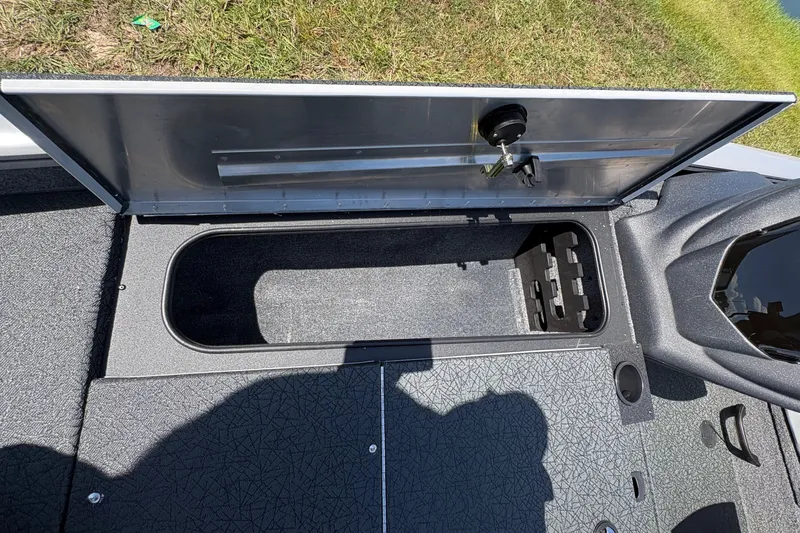 Slide: The Image of Open storage compartment on 2027 Tracker Pro Team 175 boat, showing interior details. - 17