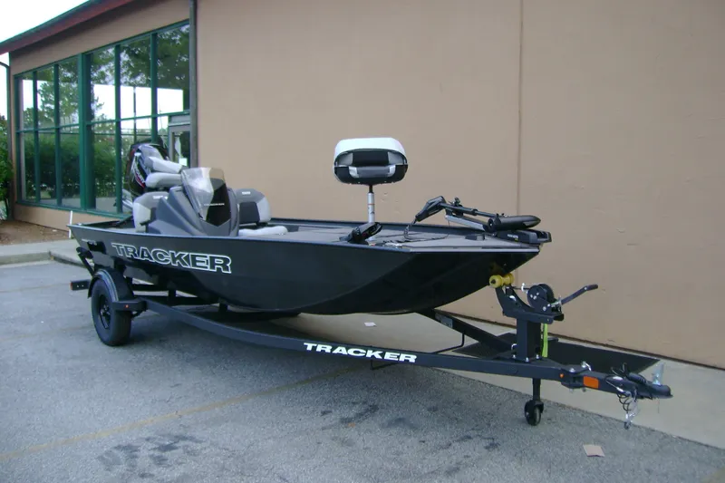 The Image of 2027 Tracker Pro 170 boat on trailer, parked outside a building. - 0