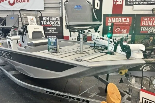 The Image of 2027 Tracker Bass Tracker Classic CC boat displayed in showroom with promotional signage. - 0