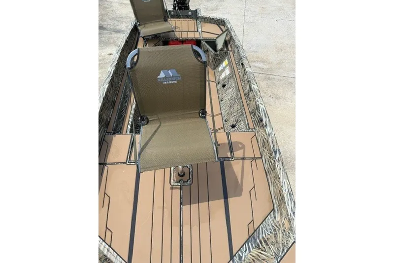 Slide: The Image of 2027 Tracker Grizzly 1553 Timber boat with camo design and seating. - 15
