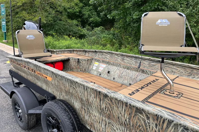 Slide: The Image of 2027 Tracker Grizzly 1553 Timber boat with camo design and Millennium Marine seats. - 15