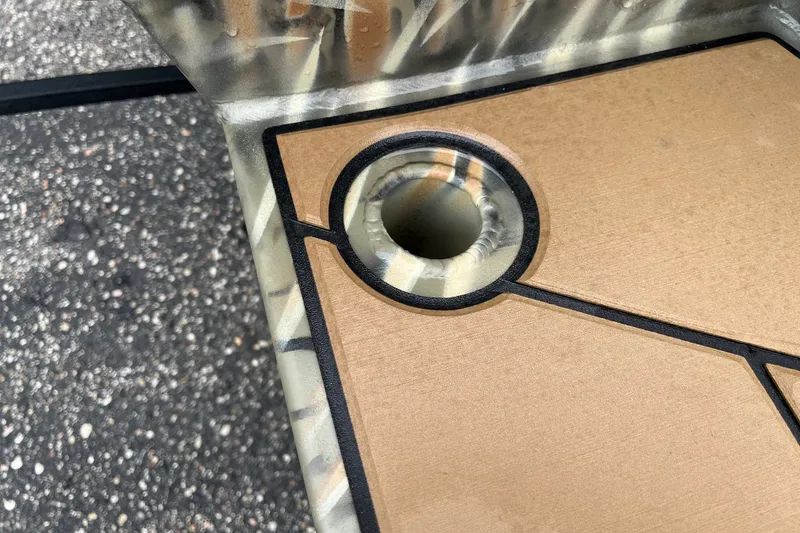 Slide: The Image of Close-up of Tracker Grizzly 1553 Timber 2027 boat deck with camo pattern. - 21