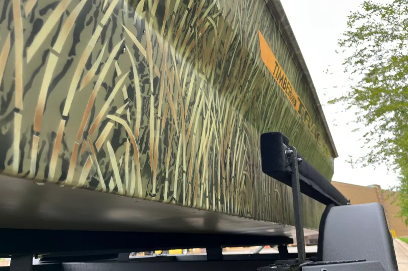 Slide: The Image of 2027 Tracker Grizzly 1553 Timber boat with camouflage design, viewed from below. - 20