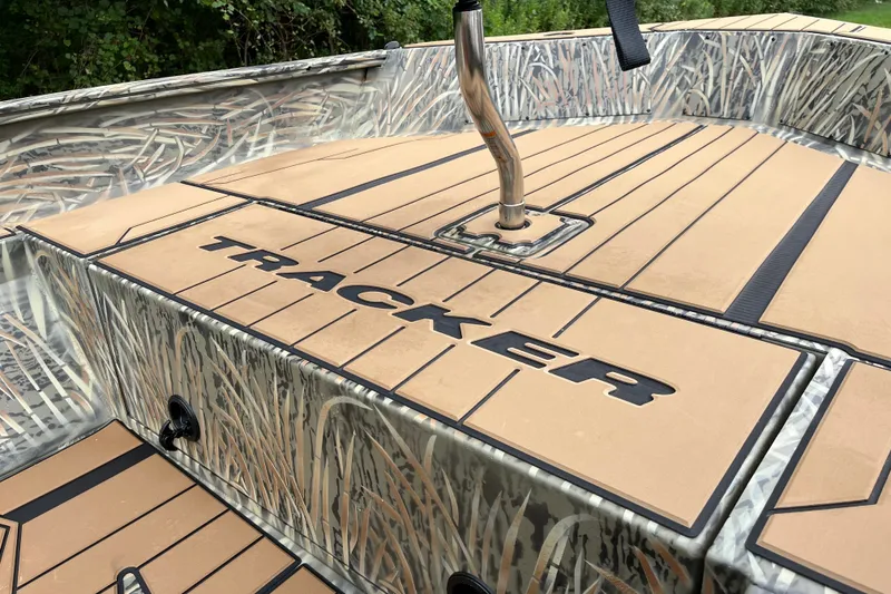 Slide: The Image of 2027 Tracker Grizzly 1553 Timber boat with camo design and sleek deck. - 17
