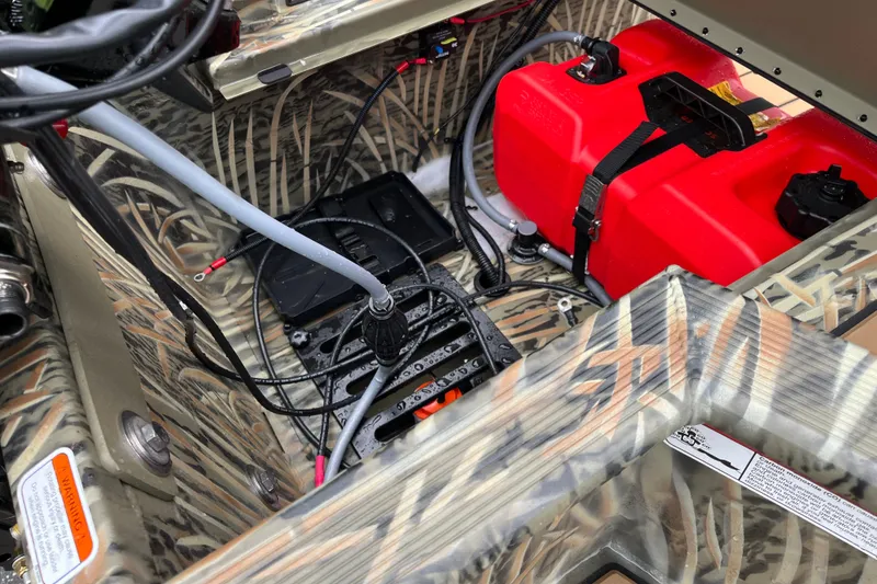 Slide: The Image of Interior of 2027 Tracker Grizzly 1553 Timber boat with red fuel tank and wiring. - 22
