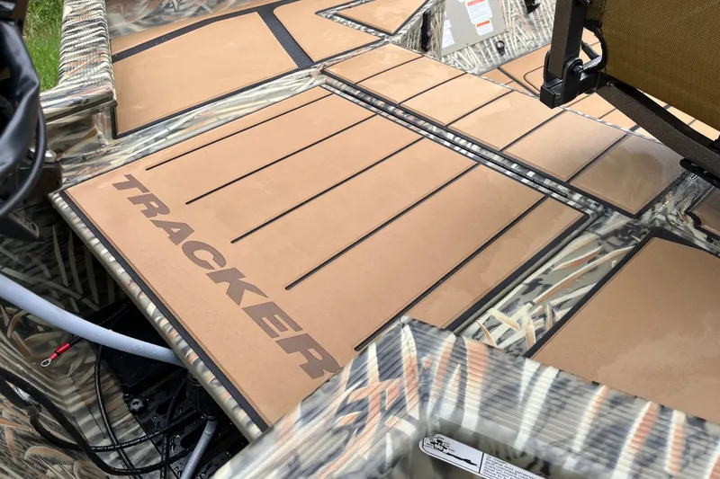 Slide: The Image of 2027 Tracker Grizzly 1553 Timber boat deck with camo design and logo. - 23