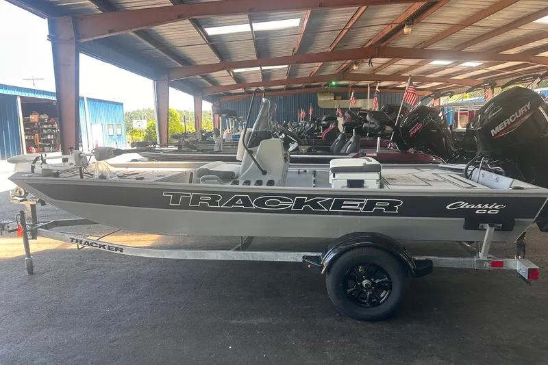 The Image of 2027 Tracker Bass Tracker Classic CC boat on trailer in covered storage area. - 0