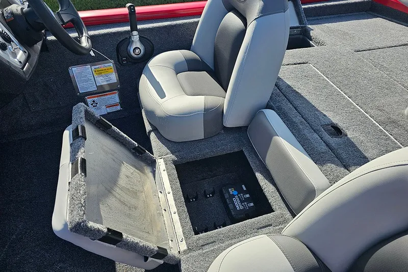 Slide: The Image of Interior of 2027 Tracker Pro Team 175 boat with open storage compartment. - 14