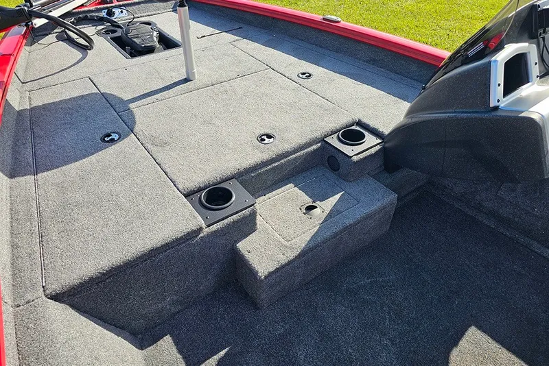 Slide: The Image of 2027 Tracker Pro Team 175 boat interior with carpeted deck and storage compartments. - 16