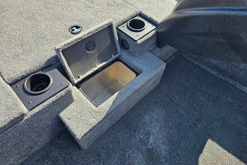 Slide: The Image of 2027 Tracker Pro Team 175 boat interior with storage compartment and cup holders. - 18