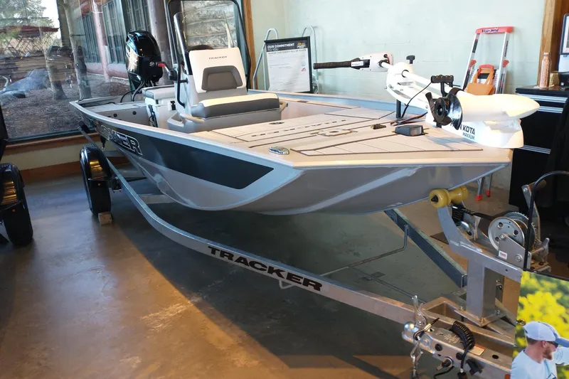The Image of 2027 Tracker Bass Tracker Classic CC fishing boat on display indoors. - 0