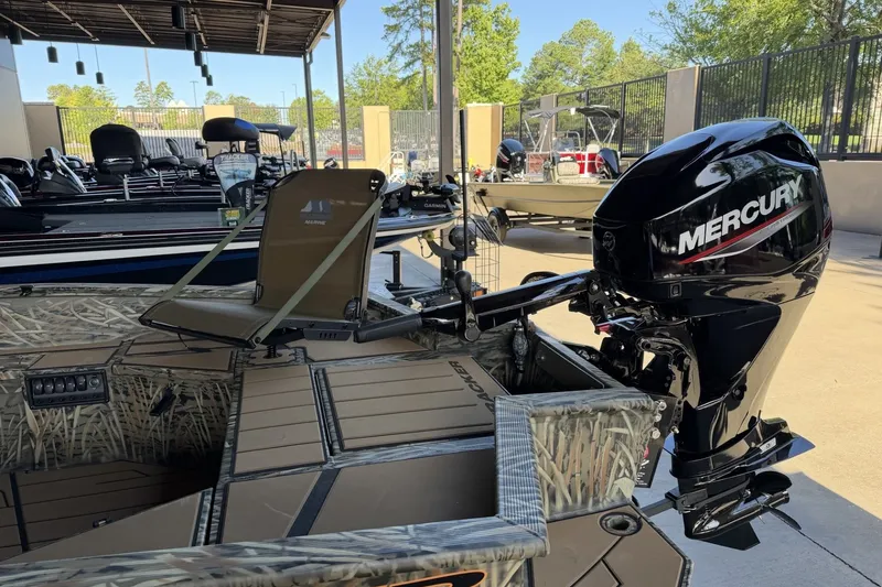 Slide: The Image of 2027 Tracker Grizzly 1553 Timber boat with Mercury outboard motor in showroom. - 13