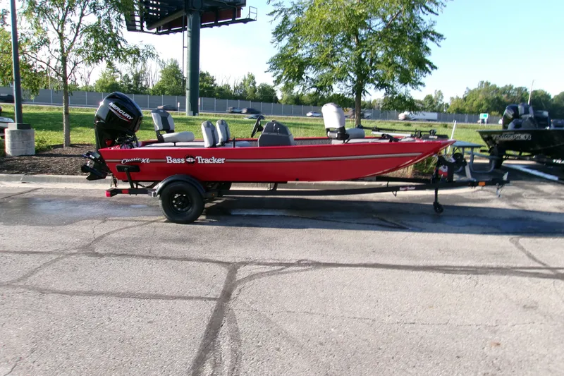 The Image of 2027 Tracker Bass Tracker Classic XL boat on trailer in parking lot. - 0