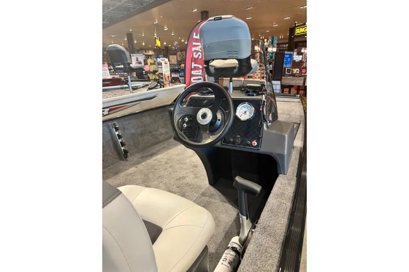 Slide: The Image of 2027 Tracker Super Guide V-16 SC boat interior with steering wheel and dashboard display. - 15