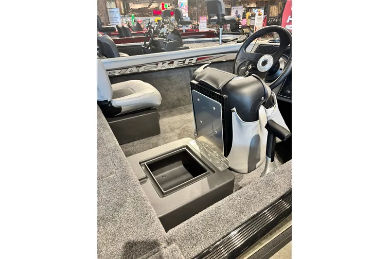 Slide: The Image of 2027 Tracker Super Guide V-16 SC boat interior with seating and steering console. - 14