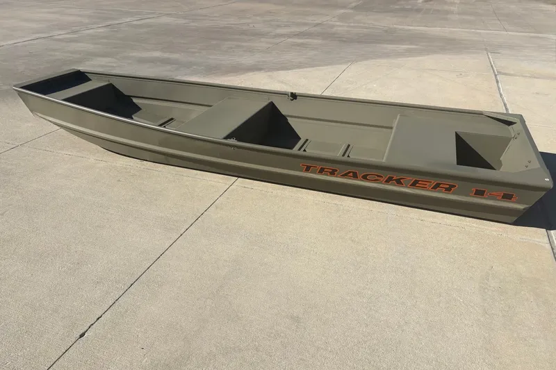 The Image of 2027 Tracker Grizzly 14 Jon boat on concrete surface, showcasing its sleek design. - 0