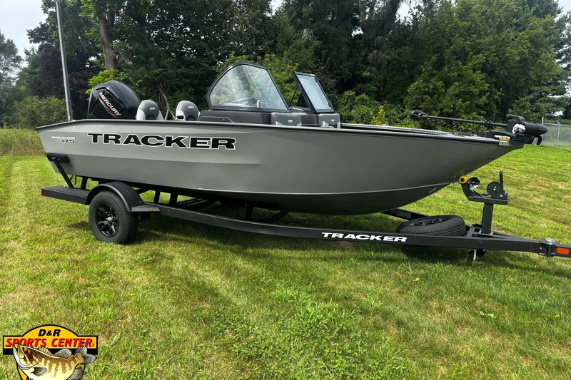 The Image of 2027 Tracker Pro Guide V-175 Combo boat on trailer, displayed outdoors on grass. - 0