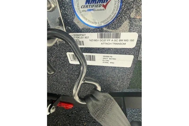 Slide: The Image of Close-up of 2027 Nitro Z18 XL Pro boat transom with certification labels and attachment hardware. - 12