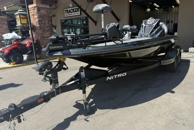 Slide: The Image of 2027 Nitro Z18 XL Pro boat with Garmin equipment, parked outside a Tracker store. - 10