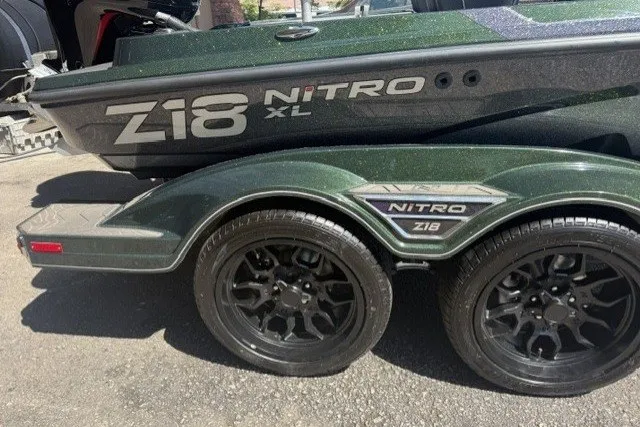 Slide: The Image of 2027 Nitro Z18 XL Pro boat trailer with black wheels and sleek design. - 2