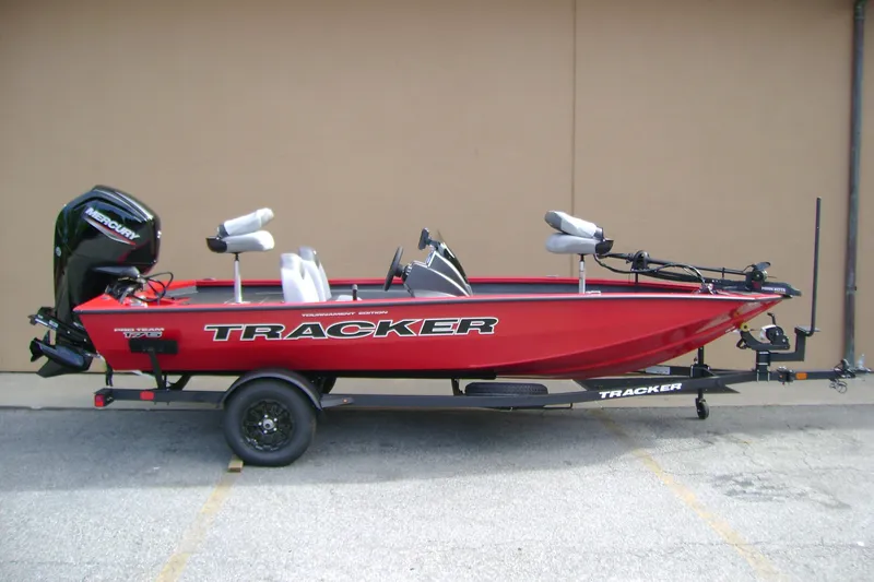 The Image of 2027 Tracker Pro Team 175 boat, red with Mercury engine, on trailer. - 0