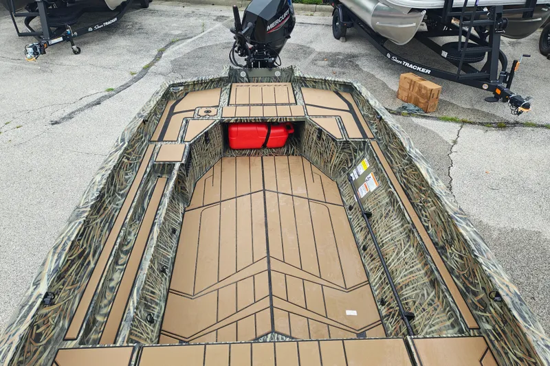 Slide: The Image of 2027 Tracker Grizzly 1553 Timber boat with camo design and spacious interior layout. - 17