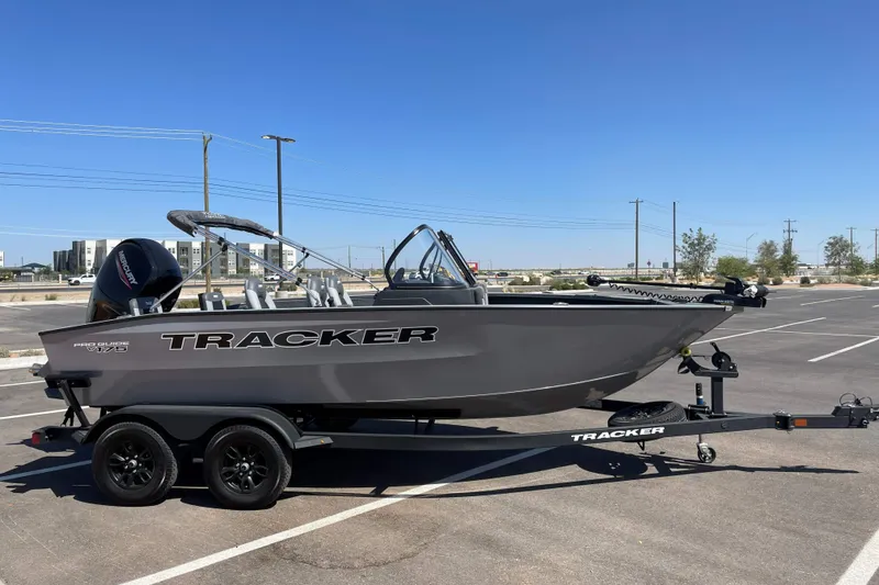The Image of 2027 Tracker Pro Guide V-175 Combo boat on trailer in parking lot. - 0
