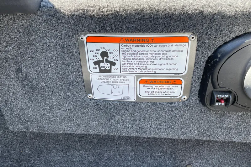 Slide: The Image of Warning label on 2027 Tracker Bass Tracker Classic XL boat, highlighting carbon monoxide risks. - 13