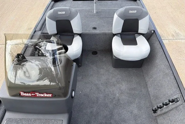 Slide: The Image of 2027 Tracker Bass Tracker Classic XL boat interior with two seats and steering console. - 37