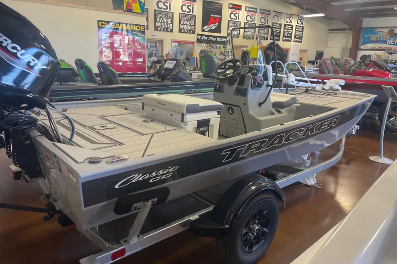 The Image of 2027 Tracker Bass Tracker Classic CC boat displayed in showroom with Mercury engine. - 0