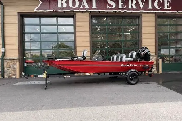 The Image of 2027 Tracker Bass Tracker Classic XL boat in front of a boat service garage. - 0