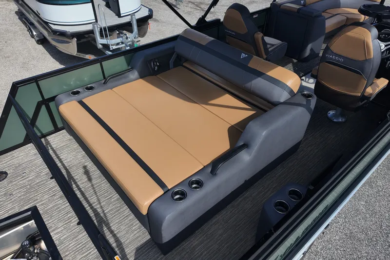 Slide: The Image of Luxurious Viaggio X22S 2027 boat interior with tan and gray seating, cup holders, and modern design. - 3