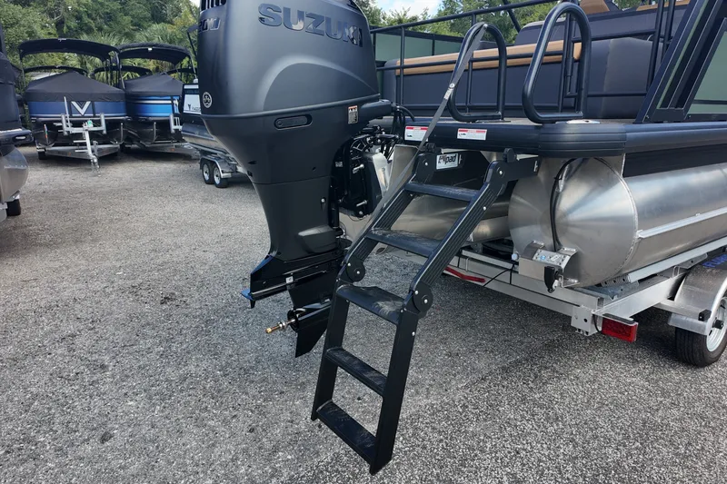Slide: The Image of 2027 Viaggio X22S pontoon boat with Suzuki outboard motor and boarding ladder. - 20