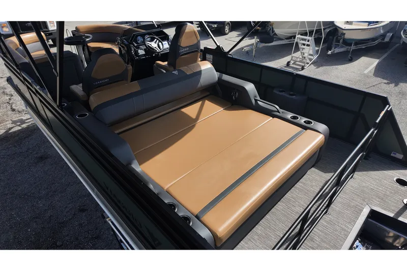Slide: The Image of 2027 Viaggio X22S boat interior with tan seating and modern dashboard. - 10