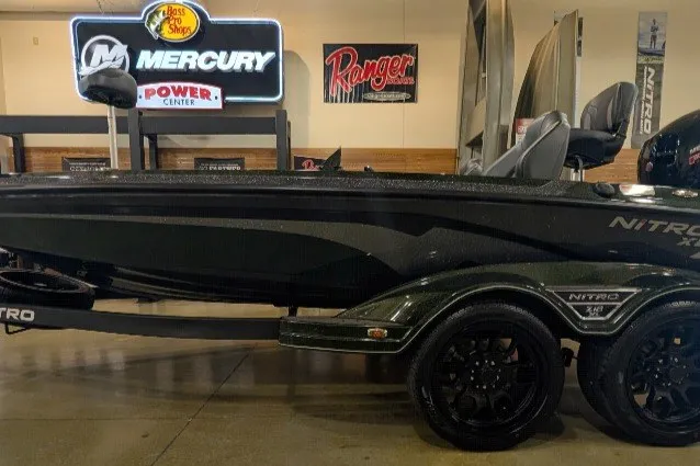 The Image of 2027 Nitro Z18 XL Pro boat displayed indoors with Mercury and Ranger signage. - 0