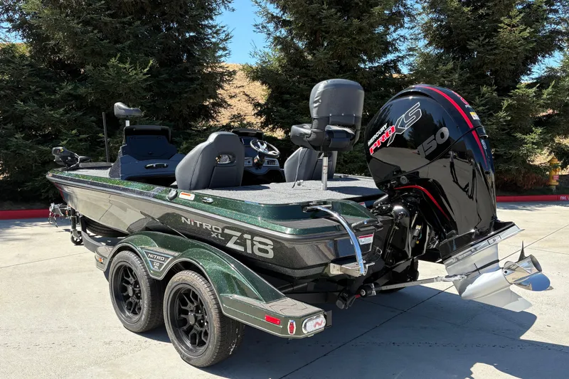Slide: The Image of 2027 Nitro Z18 XL boat with Mercury Pro XS 150 engine, parked outdoors. - 7