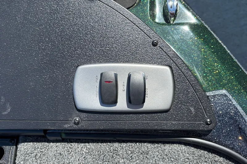 Slide: The Image of Control panel of a 2027 Nitro Z18 XL boat with switches for light and trim. - 37