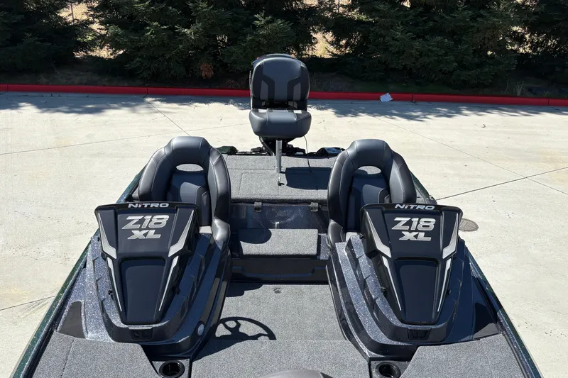 Slide: The Image of 2027 Nitro Z18 XL boat interior with dual seats and sleek design. - 18