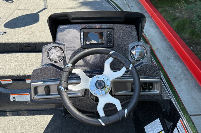 Slide: The Image of Steering console of 2027 Nitro Z18 XL boat with modern controls and display. - 19
