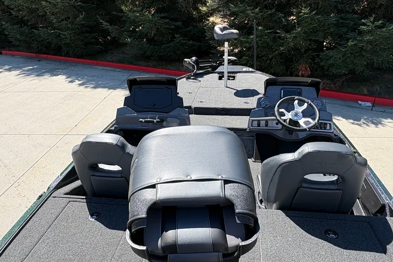 Slide: The Image of Interior view of a 2027 Nitro Z18 XL boat, featuring seating and steering console. - 21