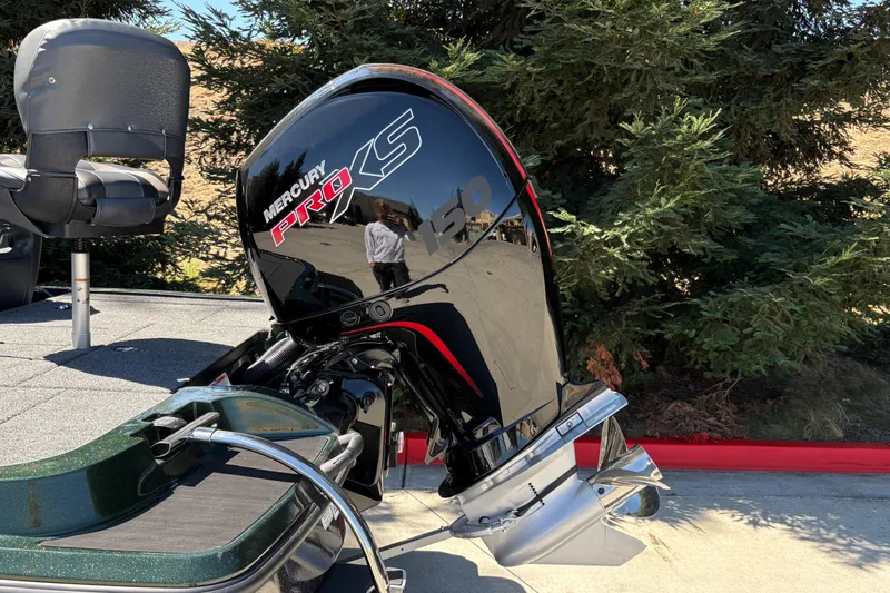 Slide: The Image of 2027 Nitro Z18 XL boat with Mercury Pro XS engine, parked outdoors. - 12
