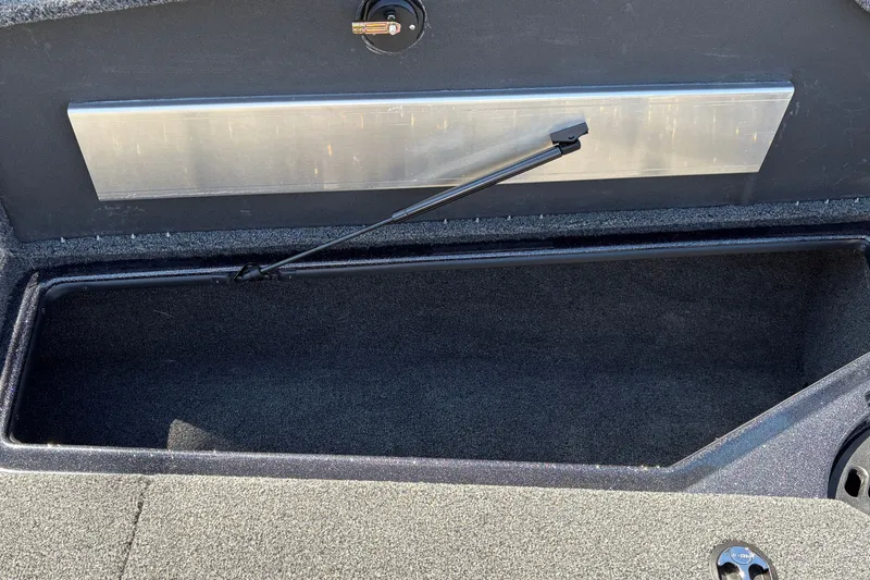 Slide: The Image of Open storage compartment in a 2027 Nitro Z18 XL boat. - 38