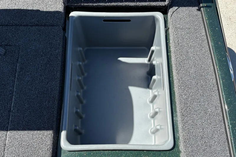 Slide: The Image of Empty storage compartment in a 2027 Nitro Z18 XL boat, featuring a gray interior. - 35
