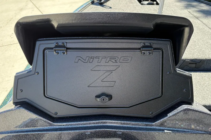 Slide: The Image of 2027 Nitro Z18 XL boat compartment with logo and secure latch. - 30
