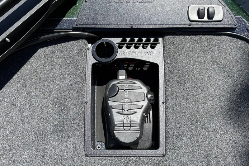 Slide: The Image of Nitro Z18 XL 2027 boat control panel with cup holder and textured surface. - 45