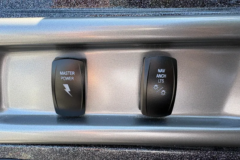 Slide: The Image of Nitro Z18 XL 2027 dashboard switches for master power and navigation lights. - 22