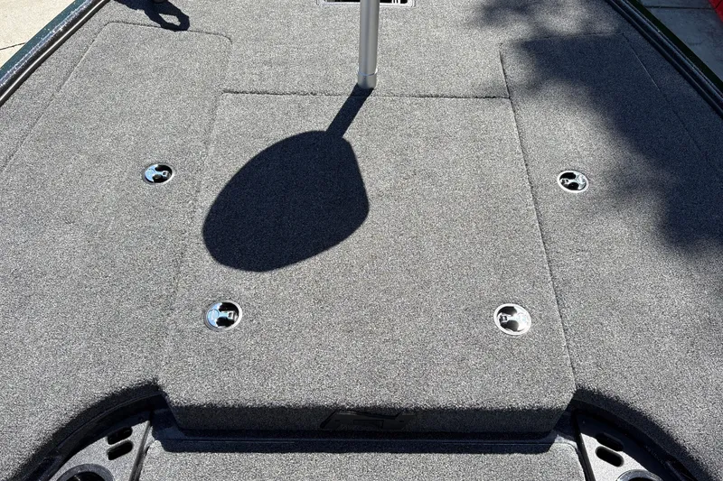 Slide: The Image of Carpeted deck of 2027 Nitro Z18 XL boat with metal fixtures. - 44