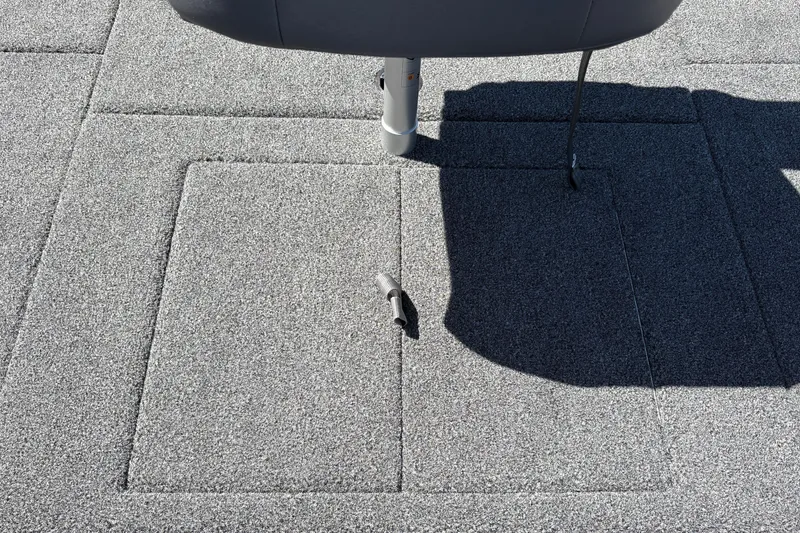 Slide: The Image of Carpeted deck of a 2027 Nitro Z18 XL boat with a seat base. - 46