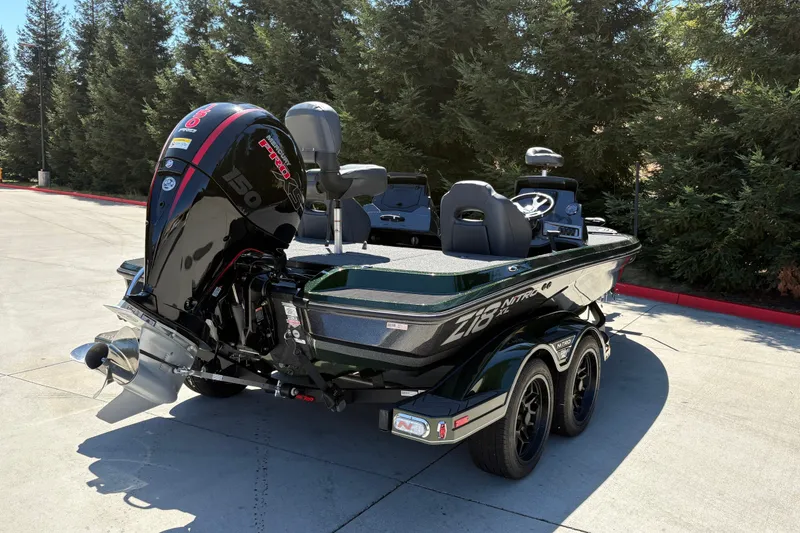 Slide: The Image of 2027 Nitro Z18 XL boat with powerful outboard motor, parked outdoors. - 6